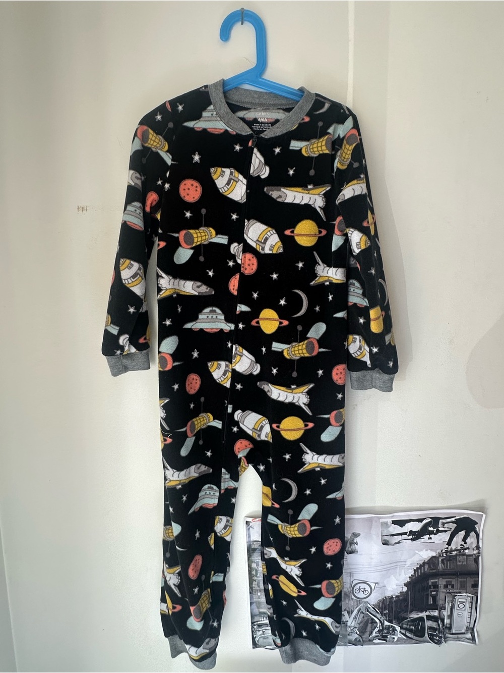 Carter’s brand fleece Kids Black Space Rocket One-Piece Pajamas.